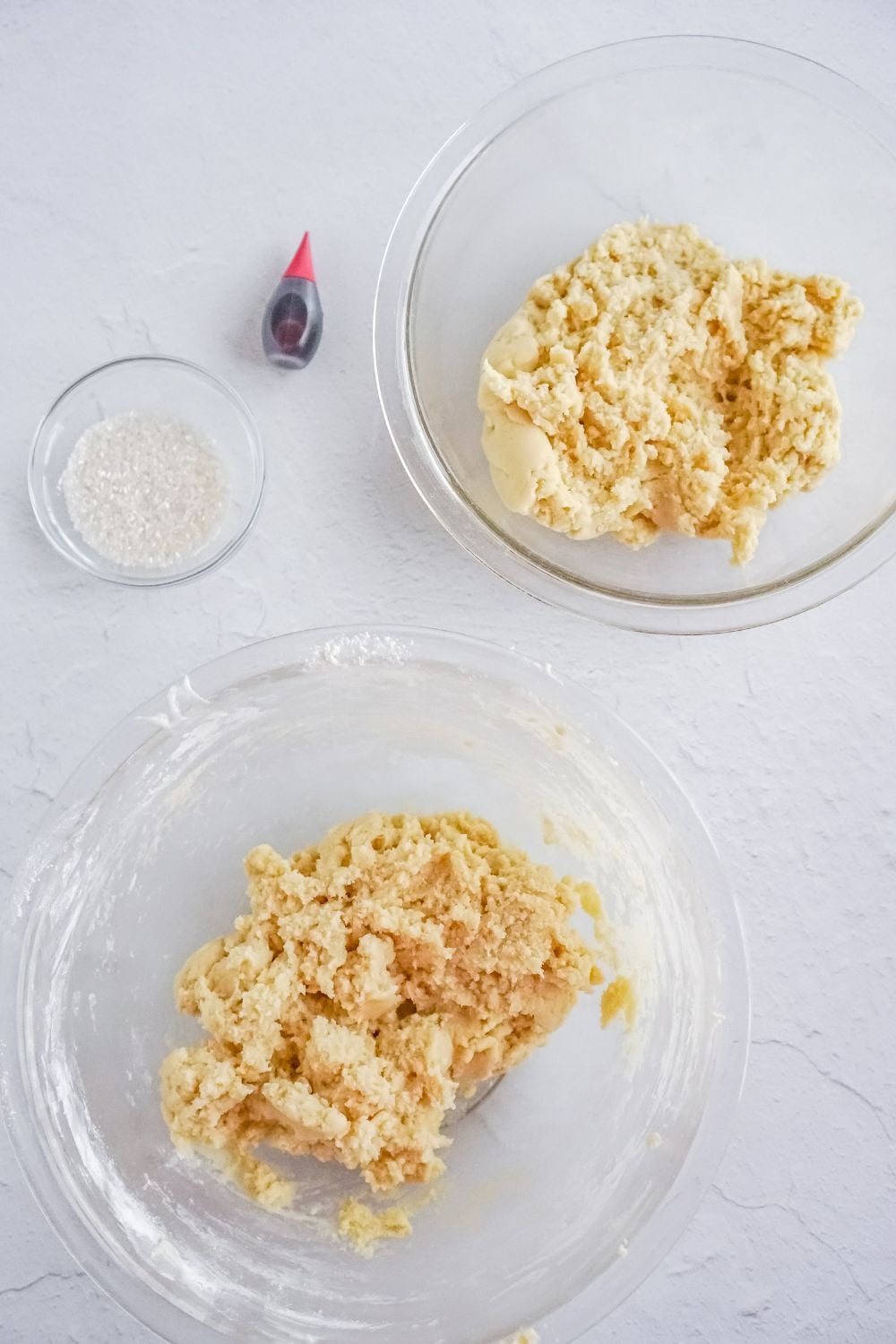two bowls of cookie dough on table