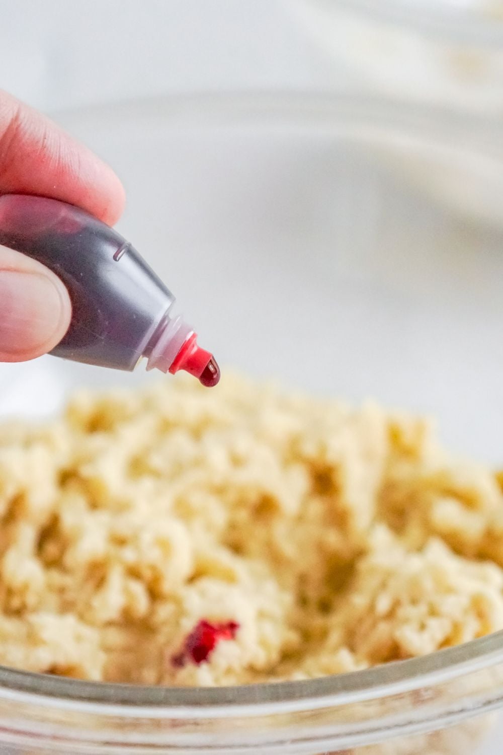 food coloring being dropped into cookie dough