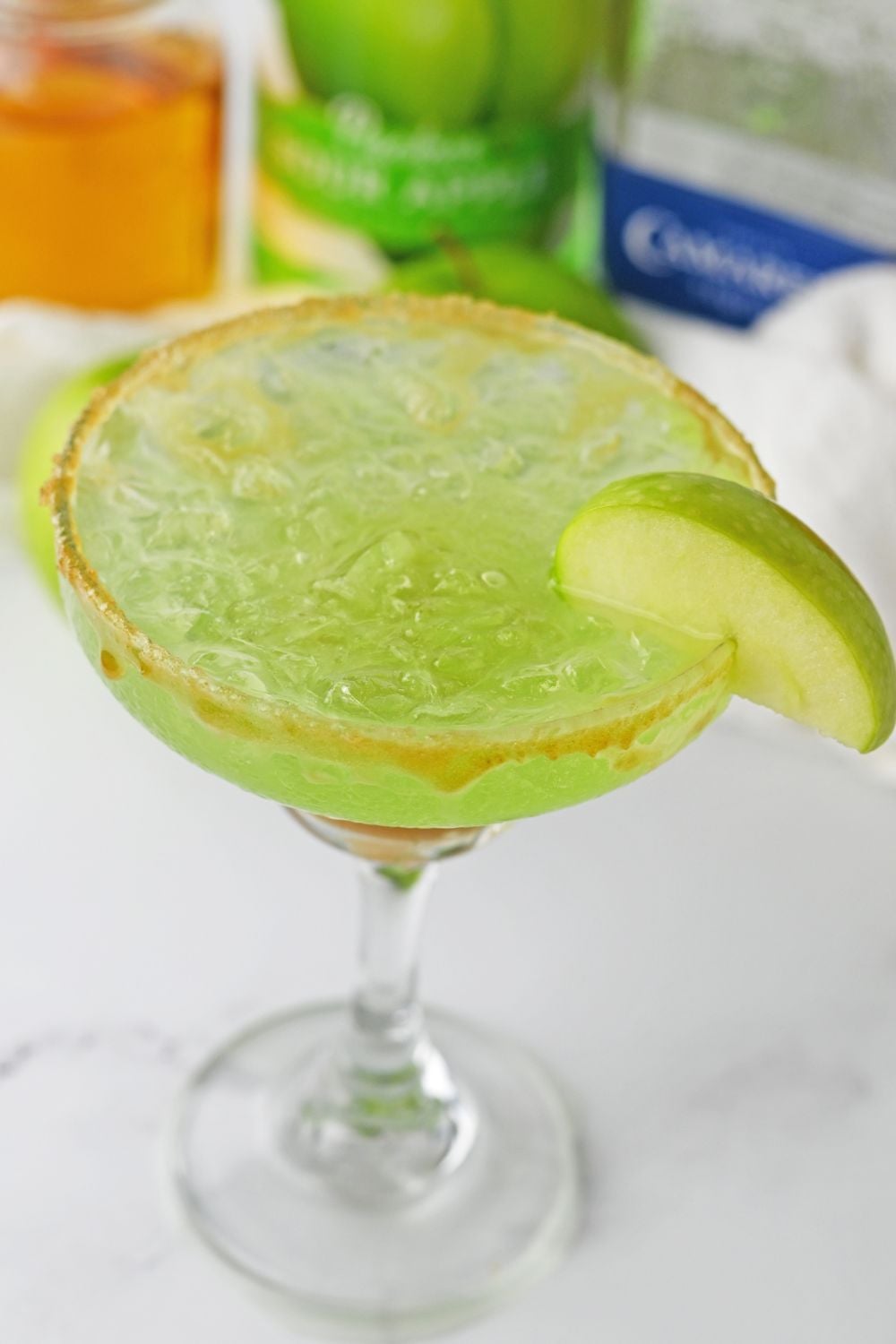 caramel apple margarita on table with overhead shot of glass