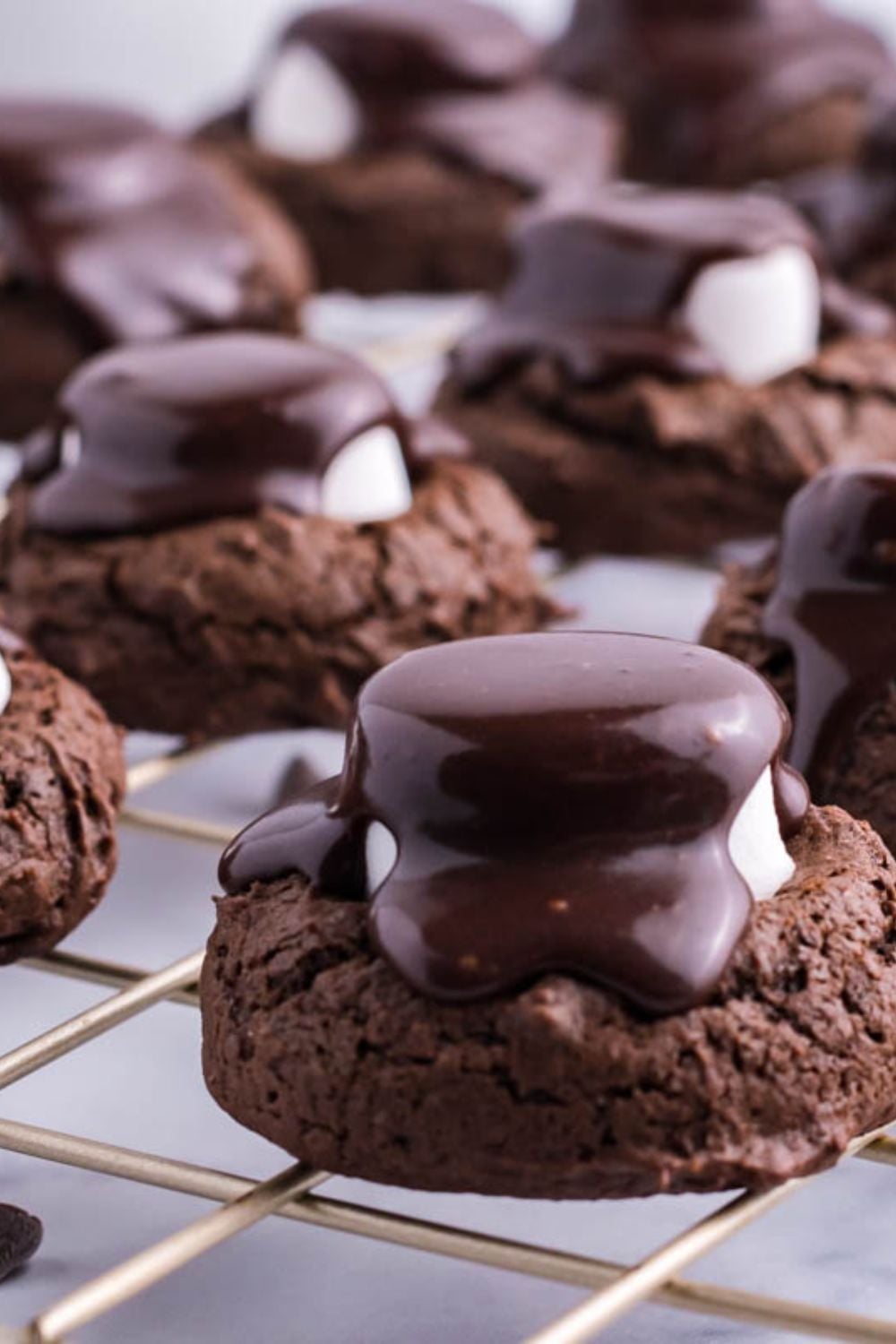 a handful of cookies on a cooling rack