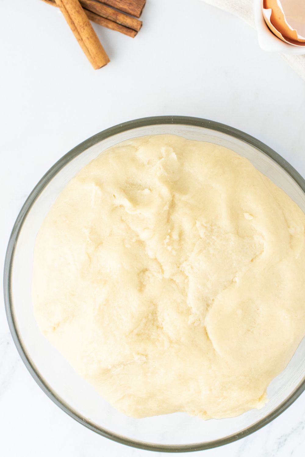 glass bowl with dough that has risen