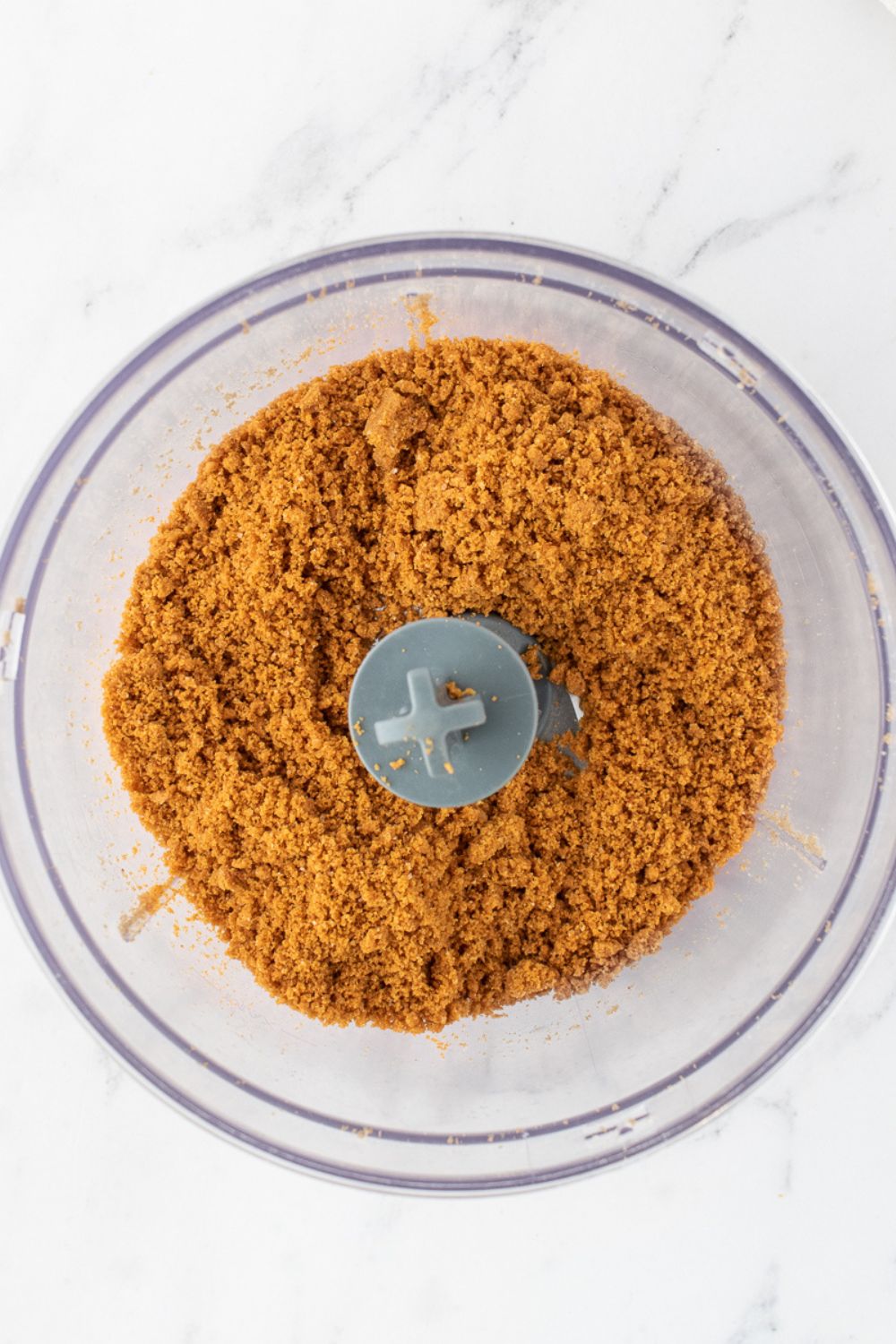 Biscoff cookie crumbs in a food processor