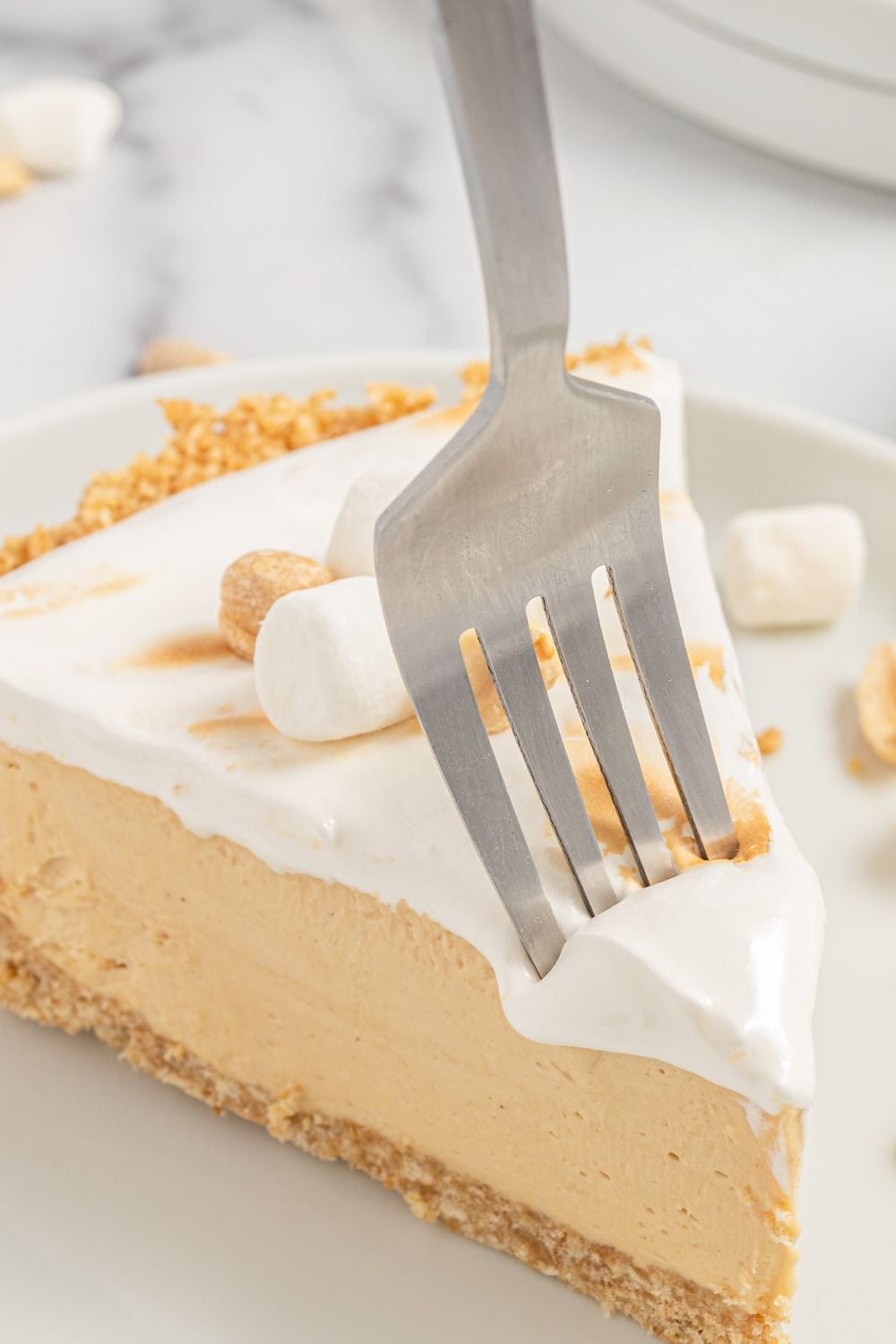 fork going into a slice of a piece of pie
