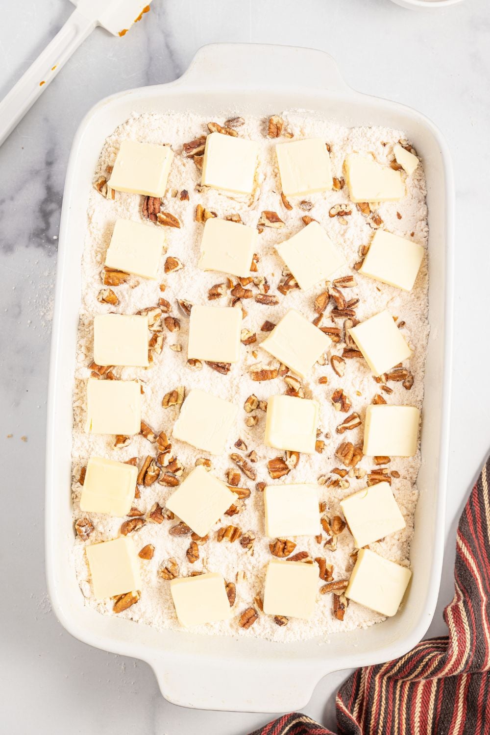 butter sliced and spread over the top of the cake
