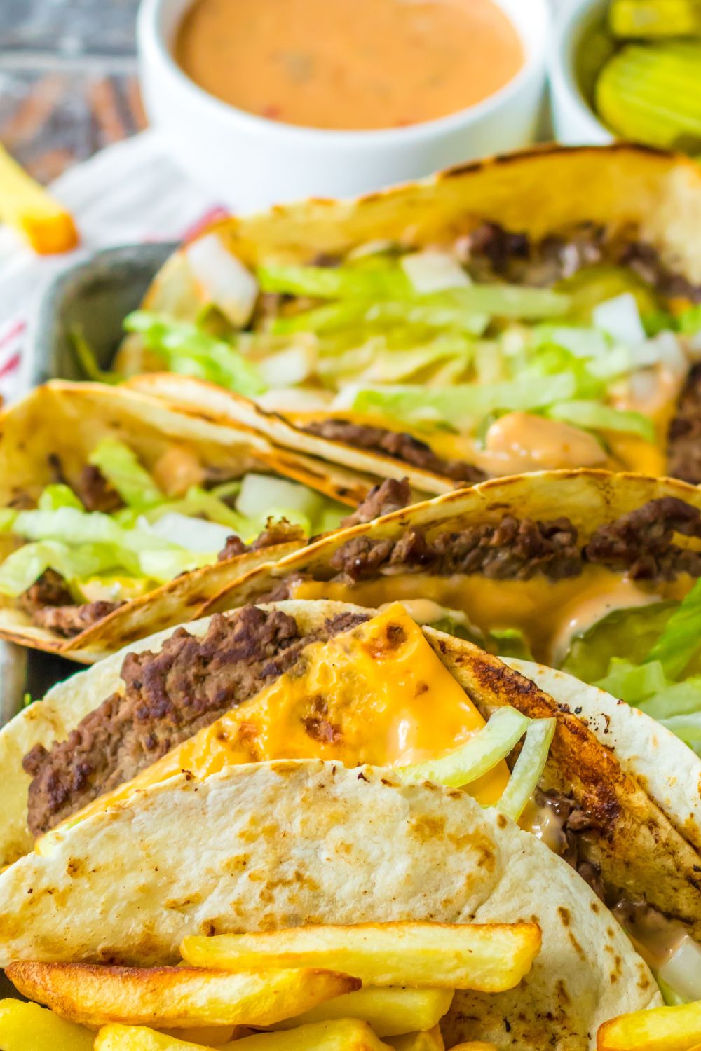 easy big mac smash tacos on a plate with sacue behind it in a container