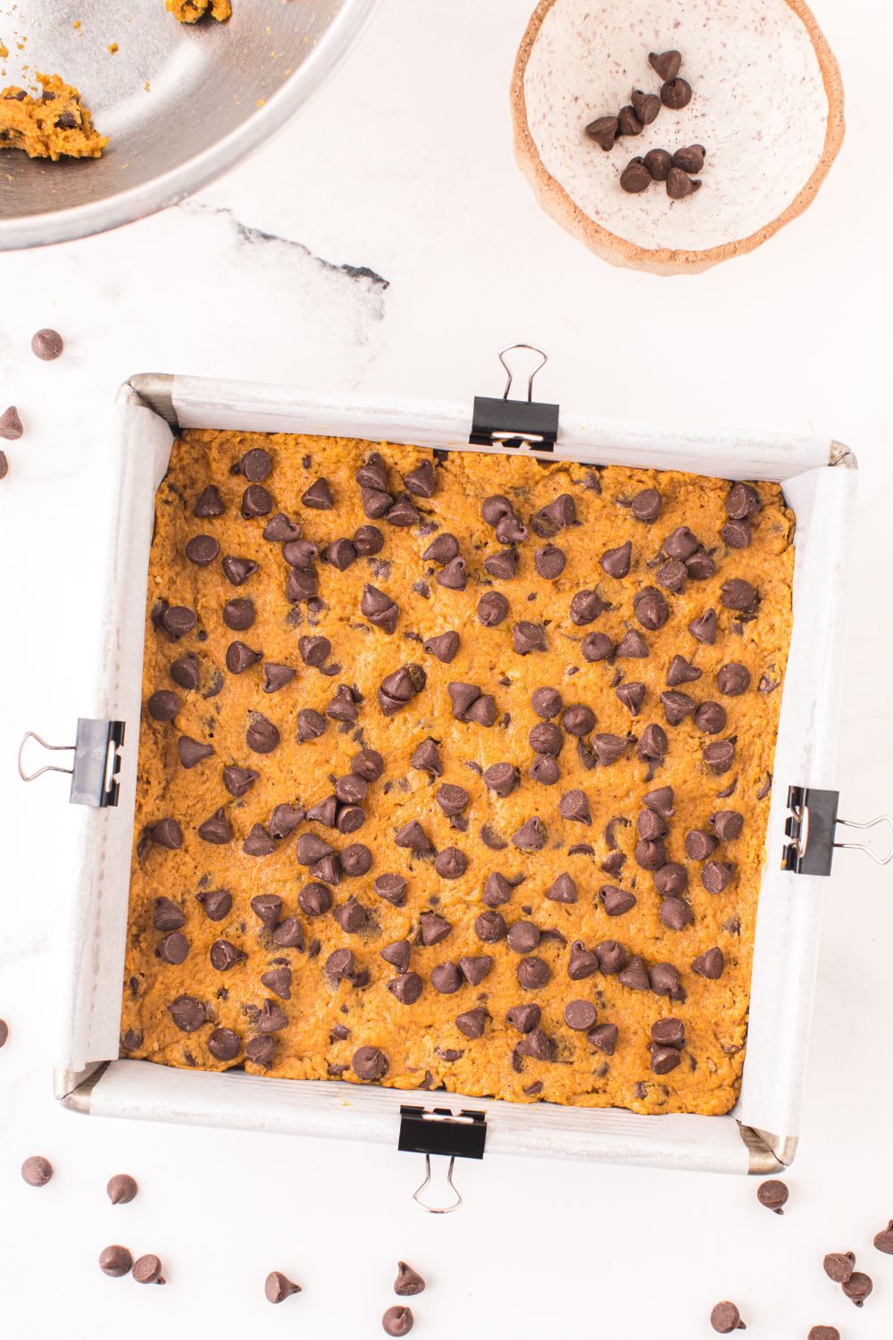 chocolate chips sprinkled on top of cookie bars