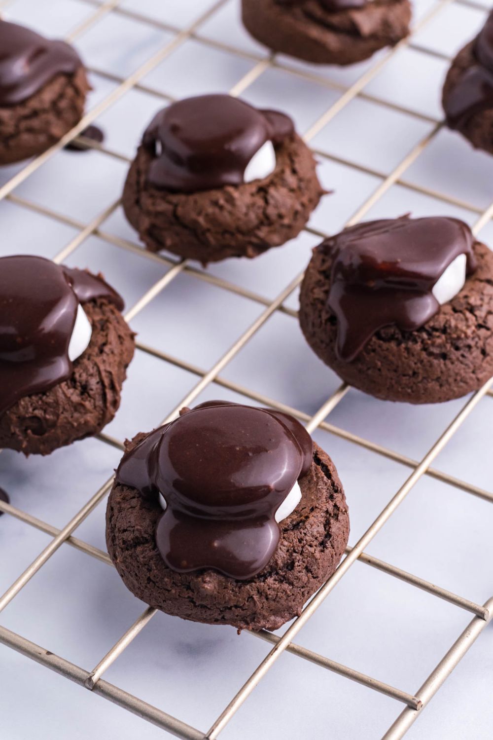 overhead shot of cookies that have chocolate on top