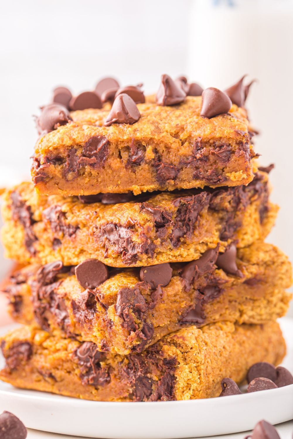 stacked pumpkin bars on plate on table
