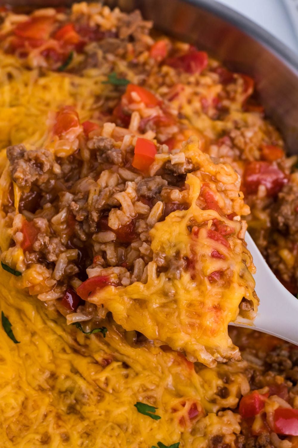 Stuffed Pepper Casserole with a spoon in it in pan