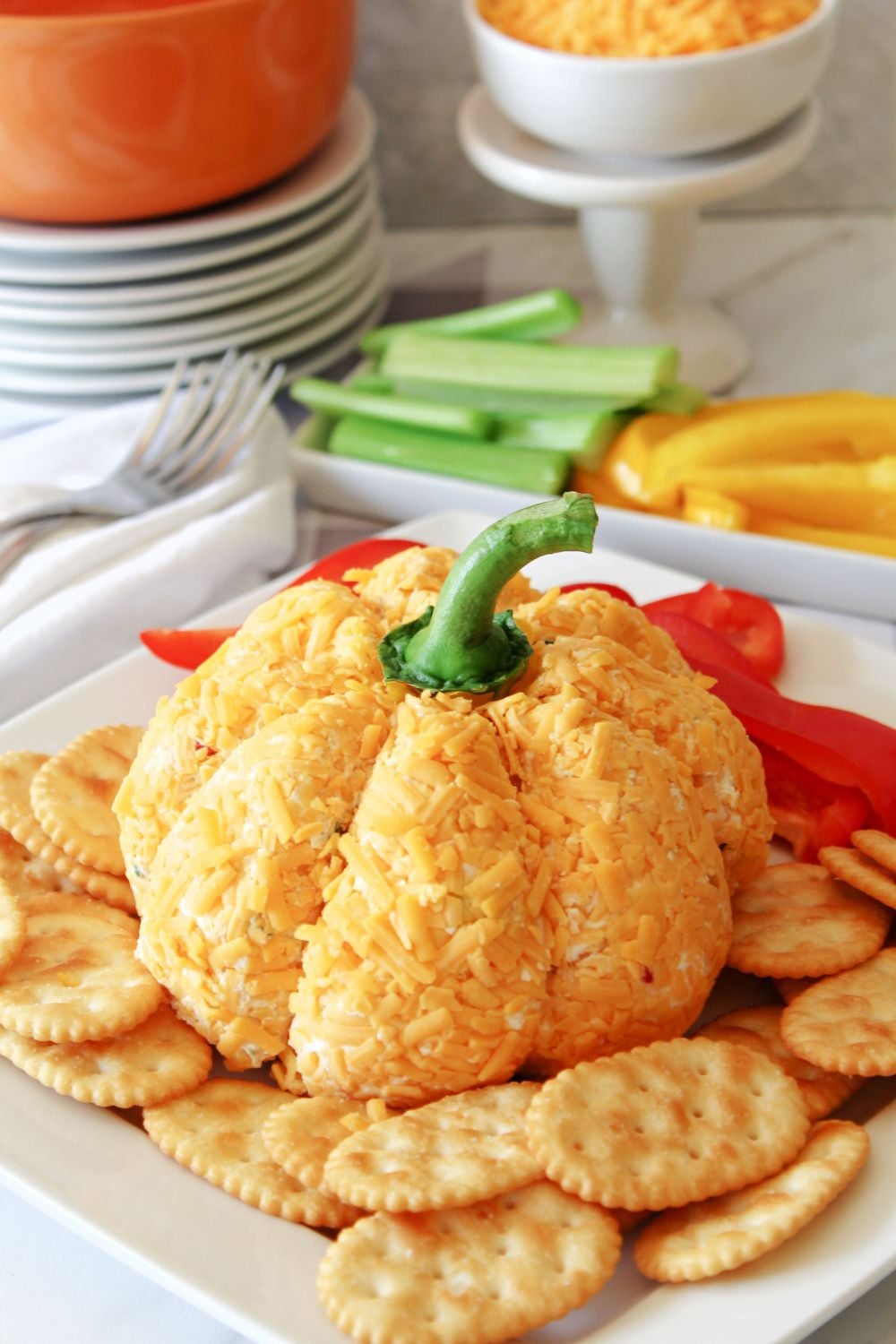 fall cheese ball on platter with dippers around it