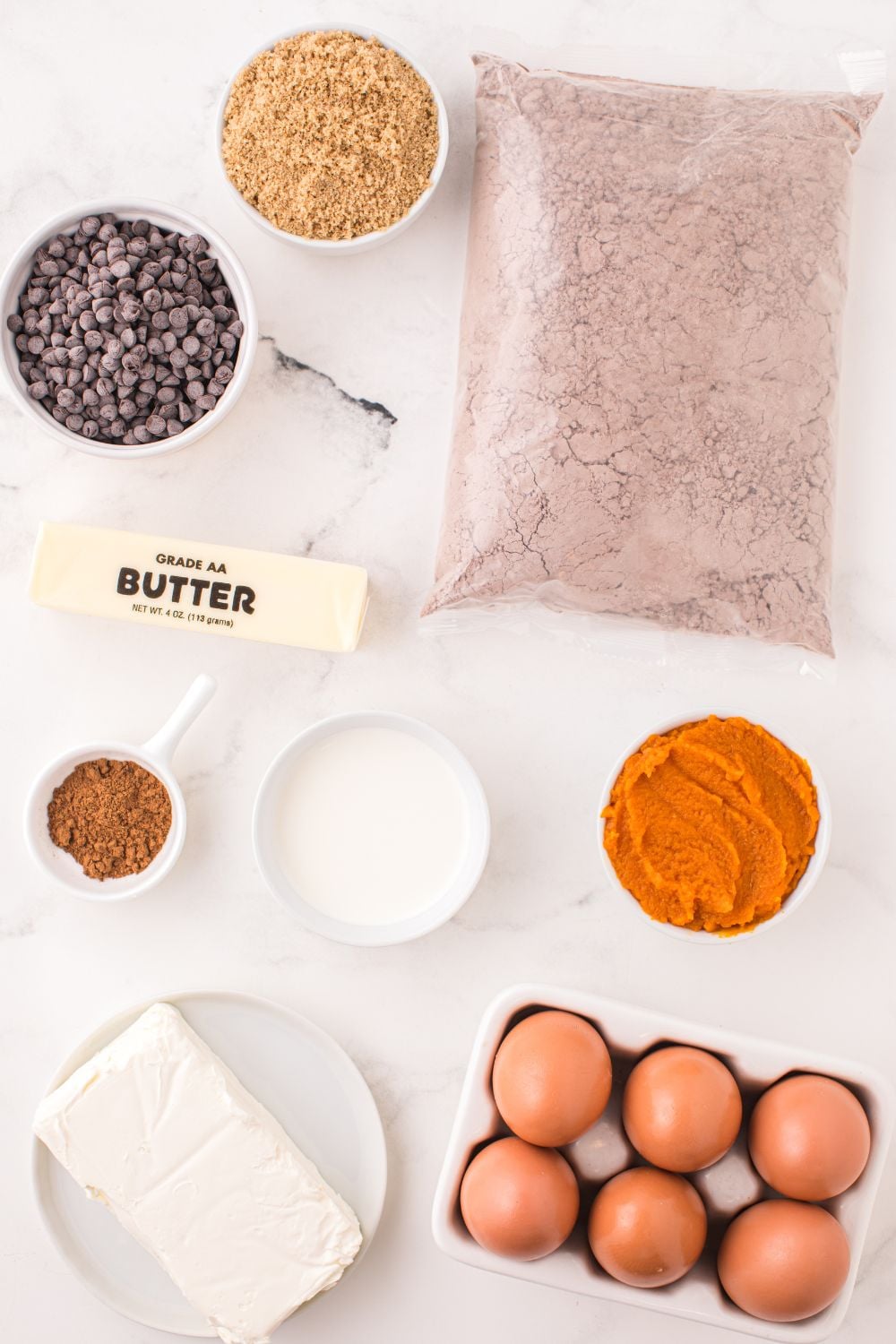fall pumpkin brownie ingredients on white counter