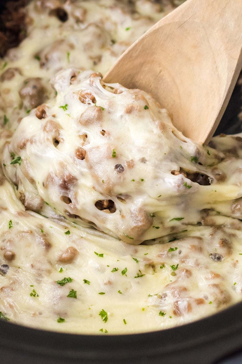 ground beef mixture with cheese in slow cooker