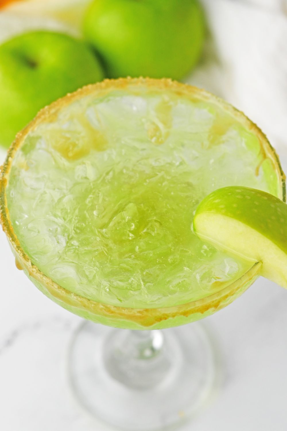 margarita green apple with apple garnished on side of glass