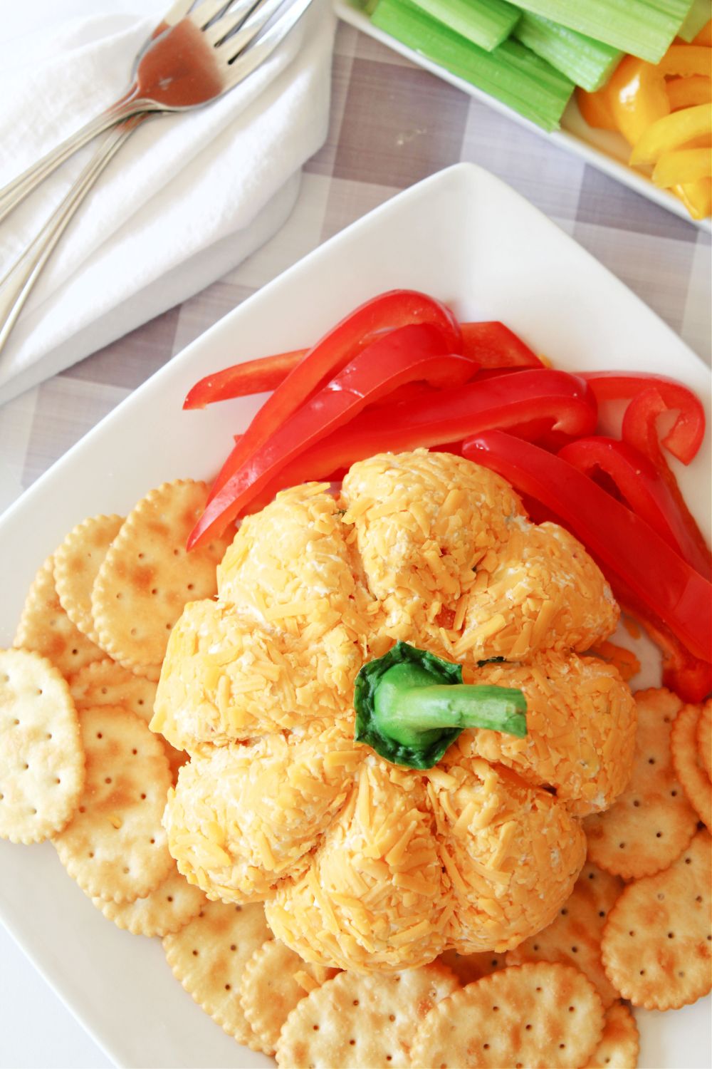 overhead shot of pumpkin cheeseball on plate