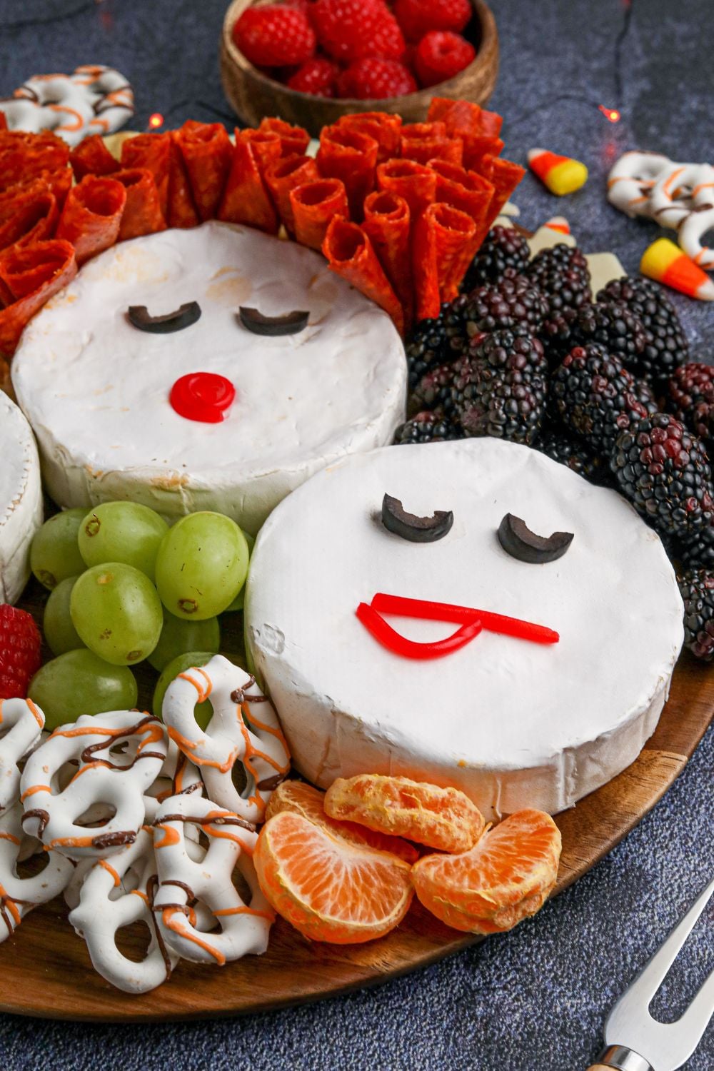 hocus pocus tray with oranges, grapes, and more around it