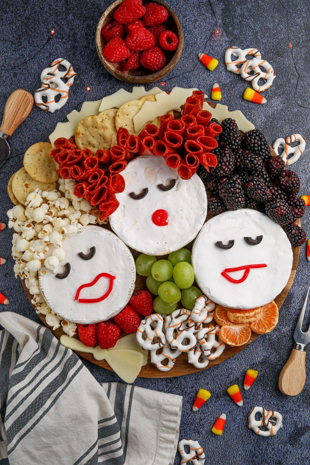 overhead shot of charcuterie board on table that looks like sanderson sisters