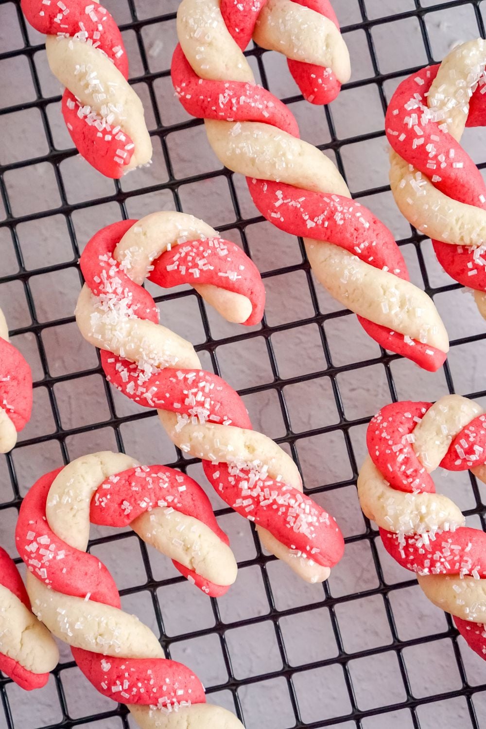 candy cane cookies on a cooling rack