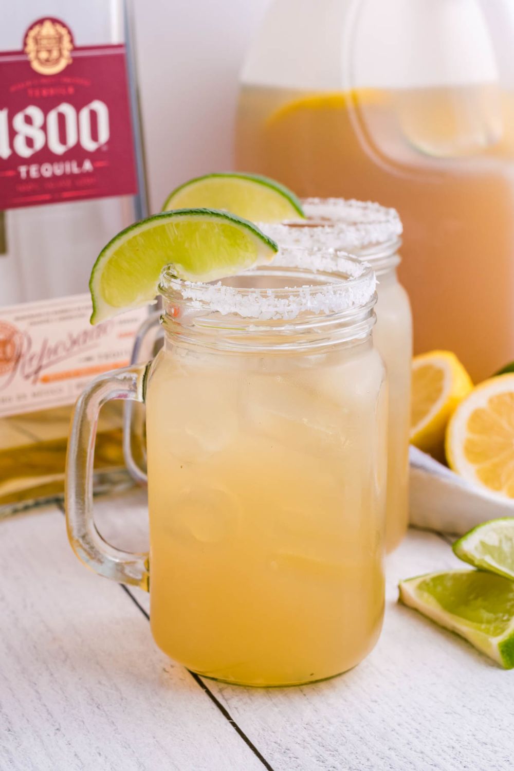 mason jar glasses with margaritas in it