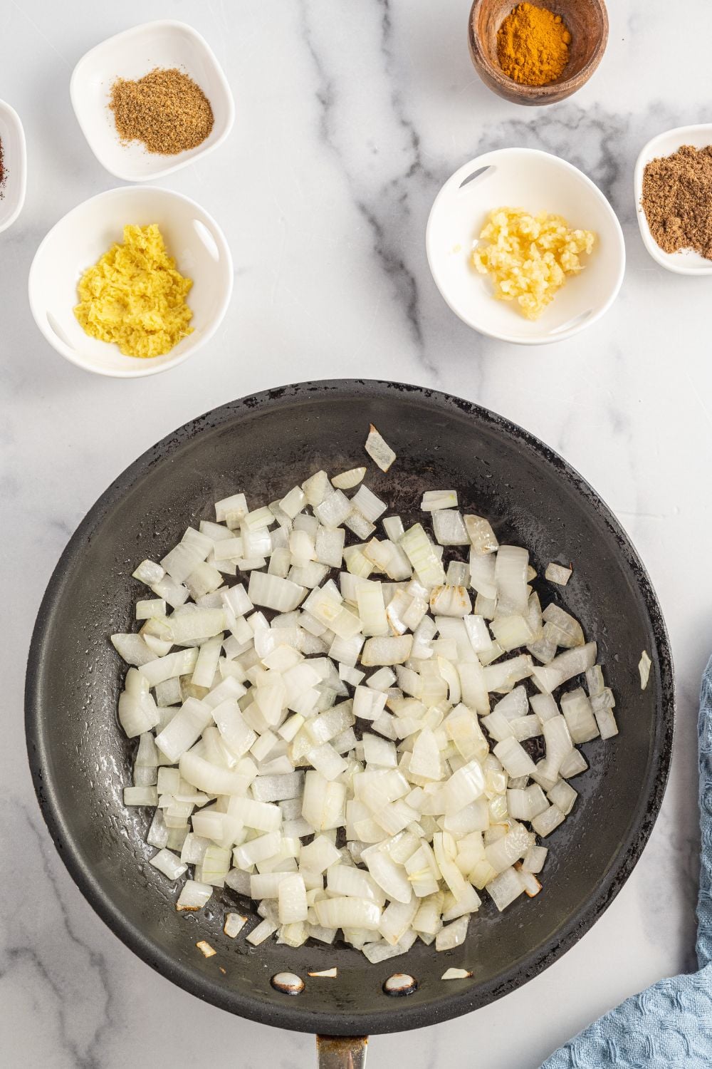 onions in a pan that are diced up