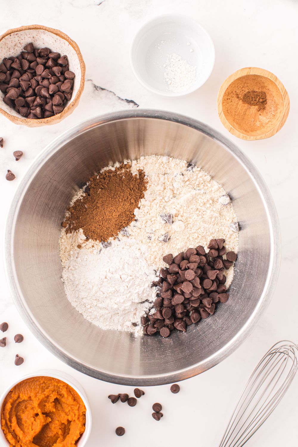 dry ingredients for cookie bars in a metal bowl