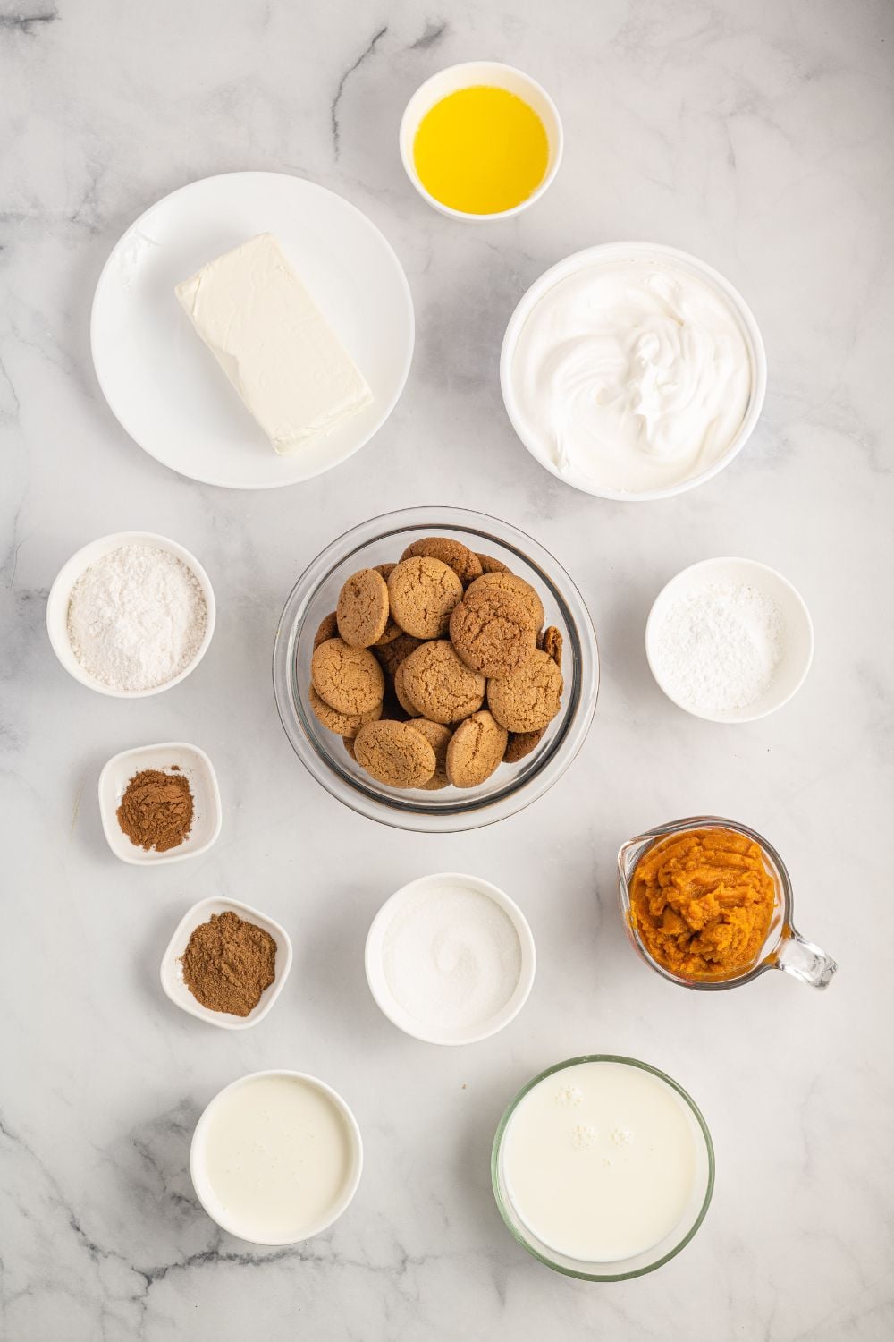 ingredients for a pumpkin delight on table all in glass containers