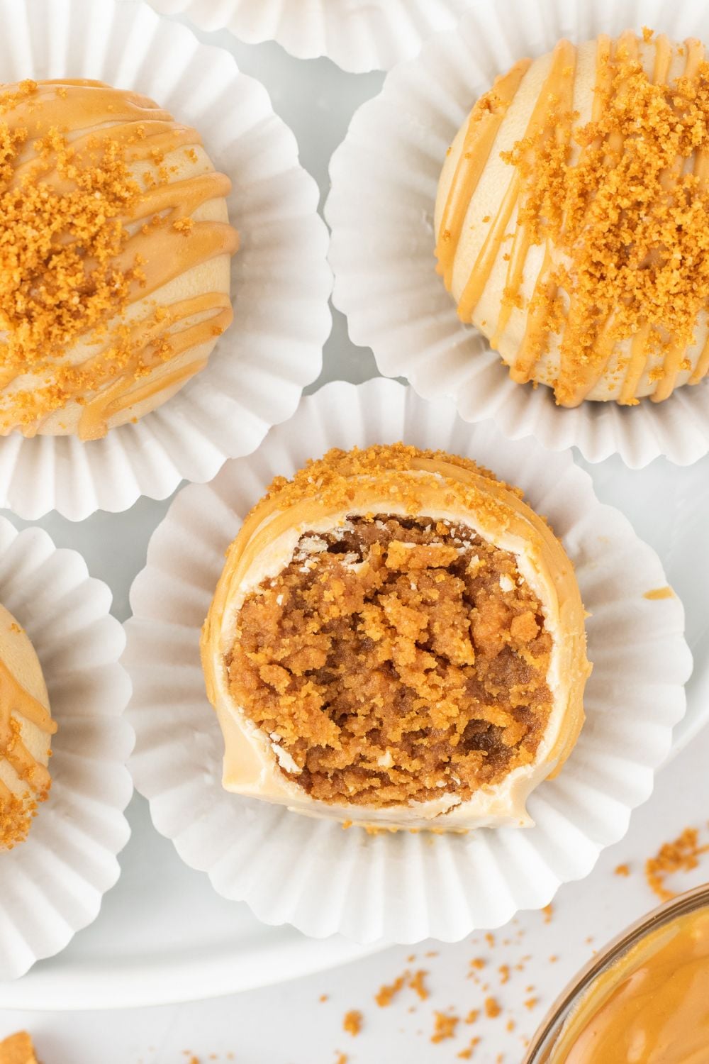 overhead shot of truffles on cupcake liners and a bite taken out