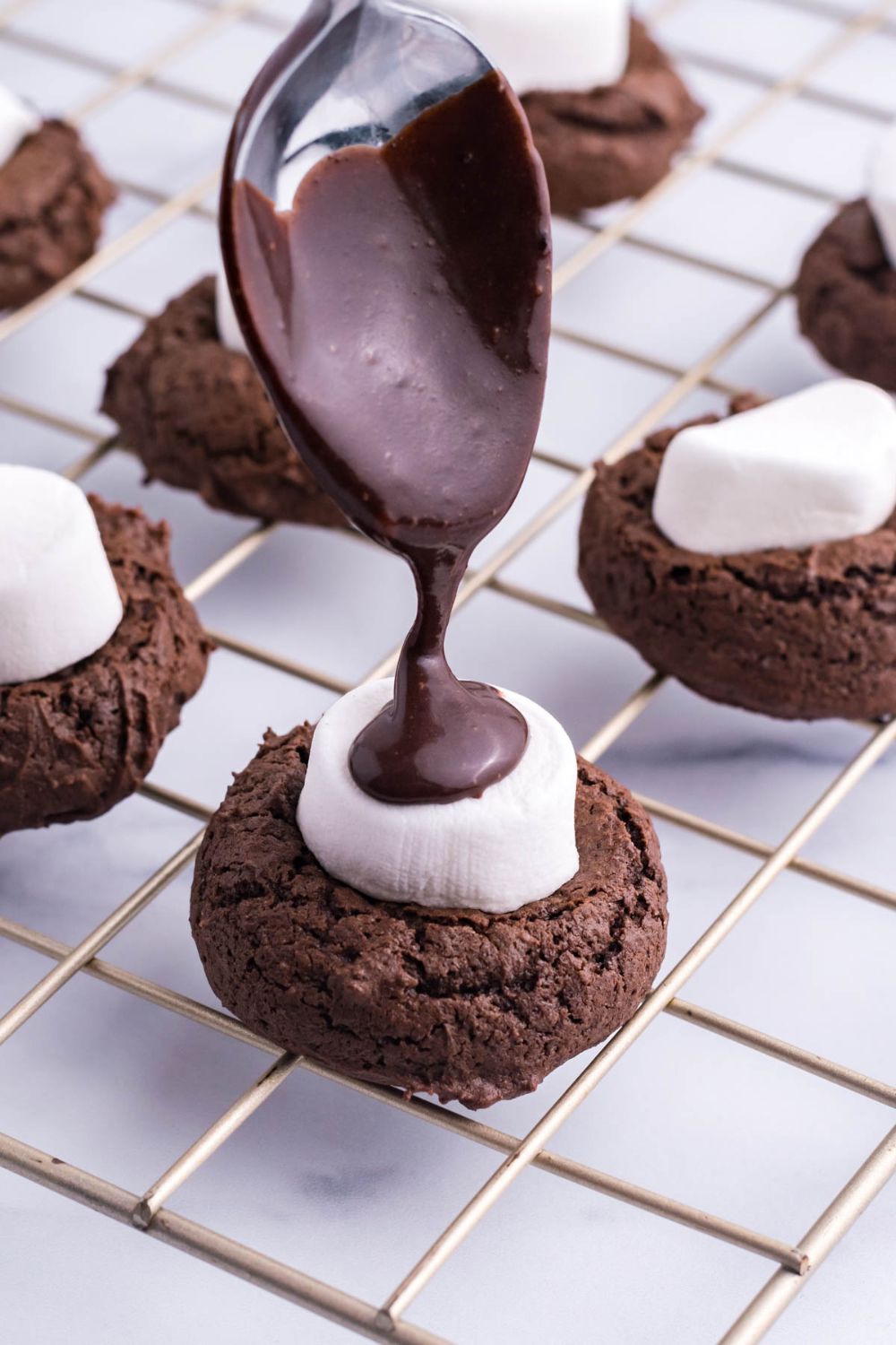 chocolate sauce pouring on marshmallow