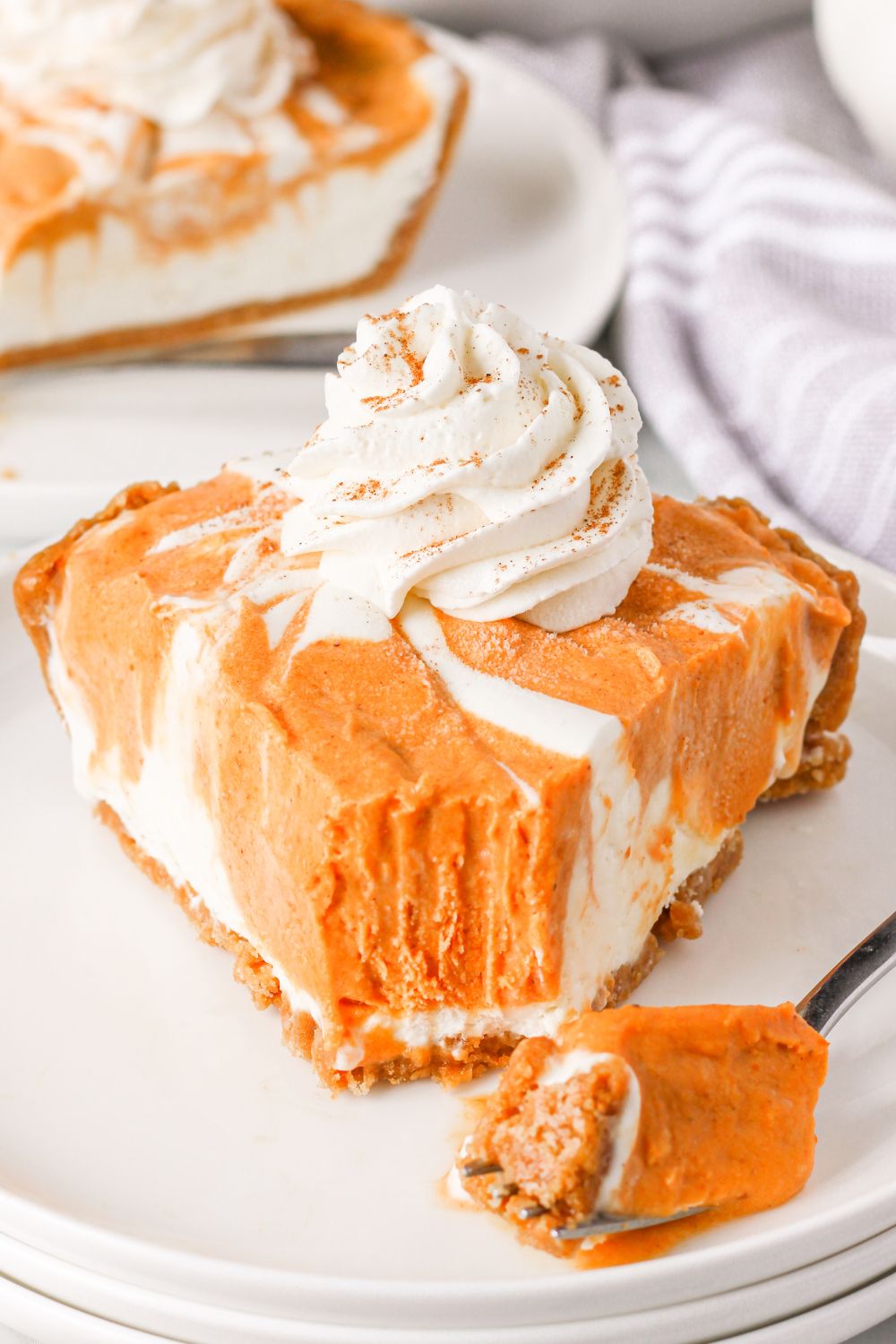 no churn pumpkin pie ice cream with pie slice on plate