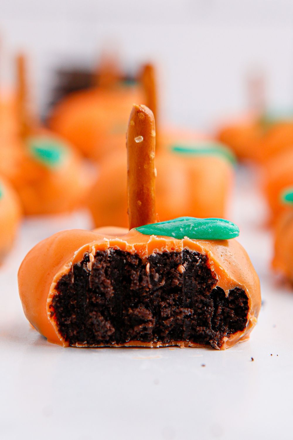 oreo ball shaped like pumpkin with bite taken out