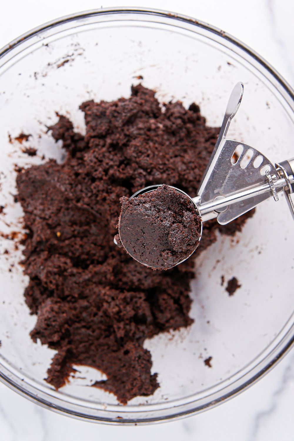 scoop of Oreo truffle mixture in a cookie scoop