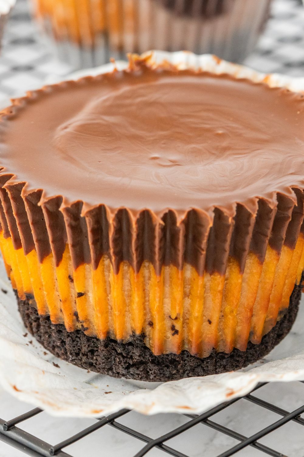 peanut butter cheesecake bite on a tray with liner taken off