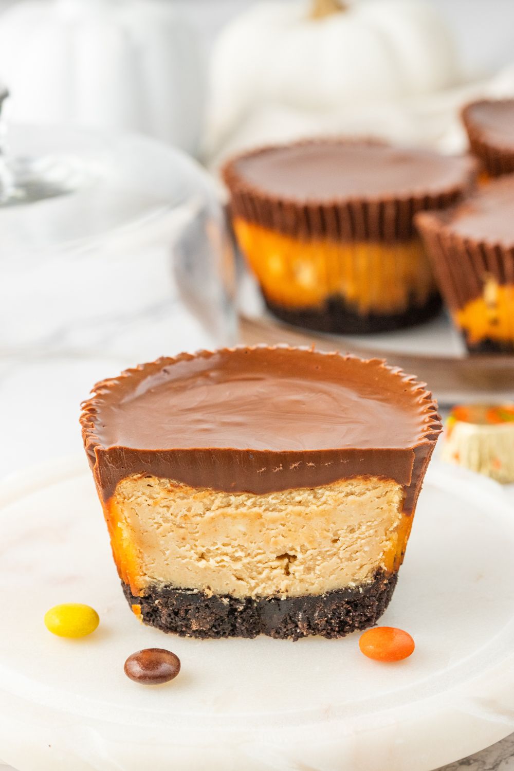chocolate peanut butter cup cheesecake sliced on a plate