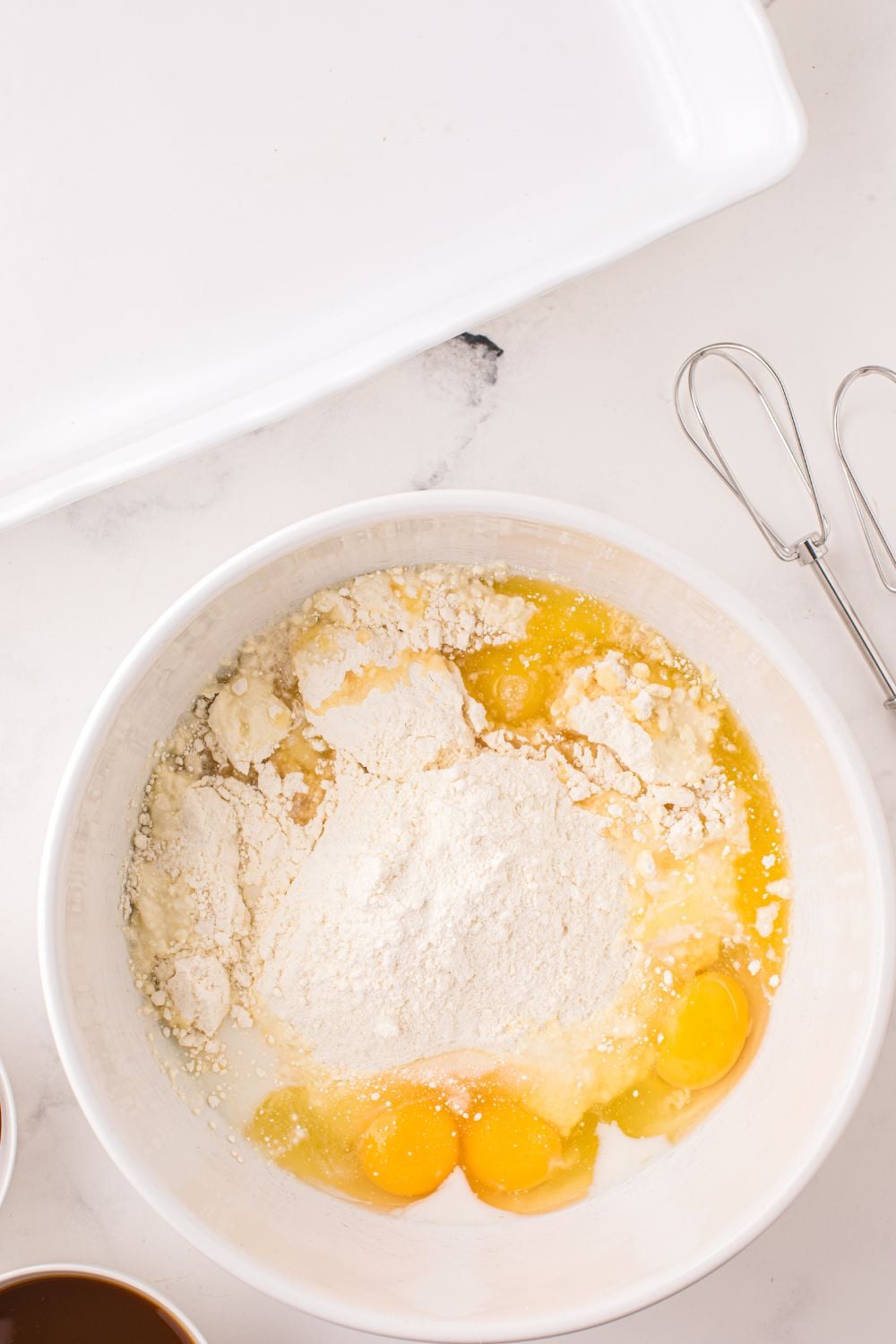cake batter mixture in a white bowl on table