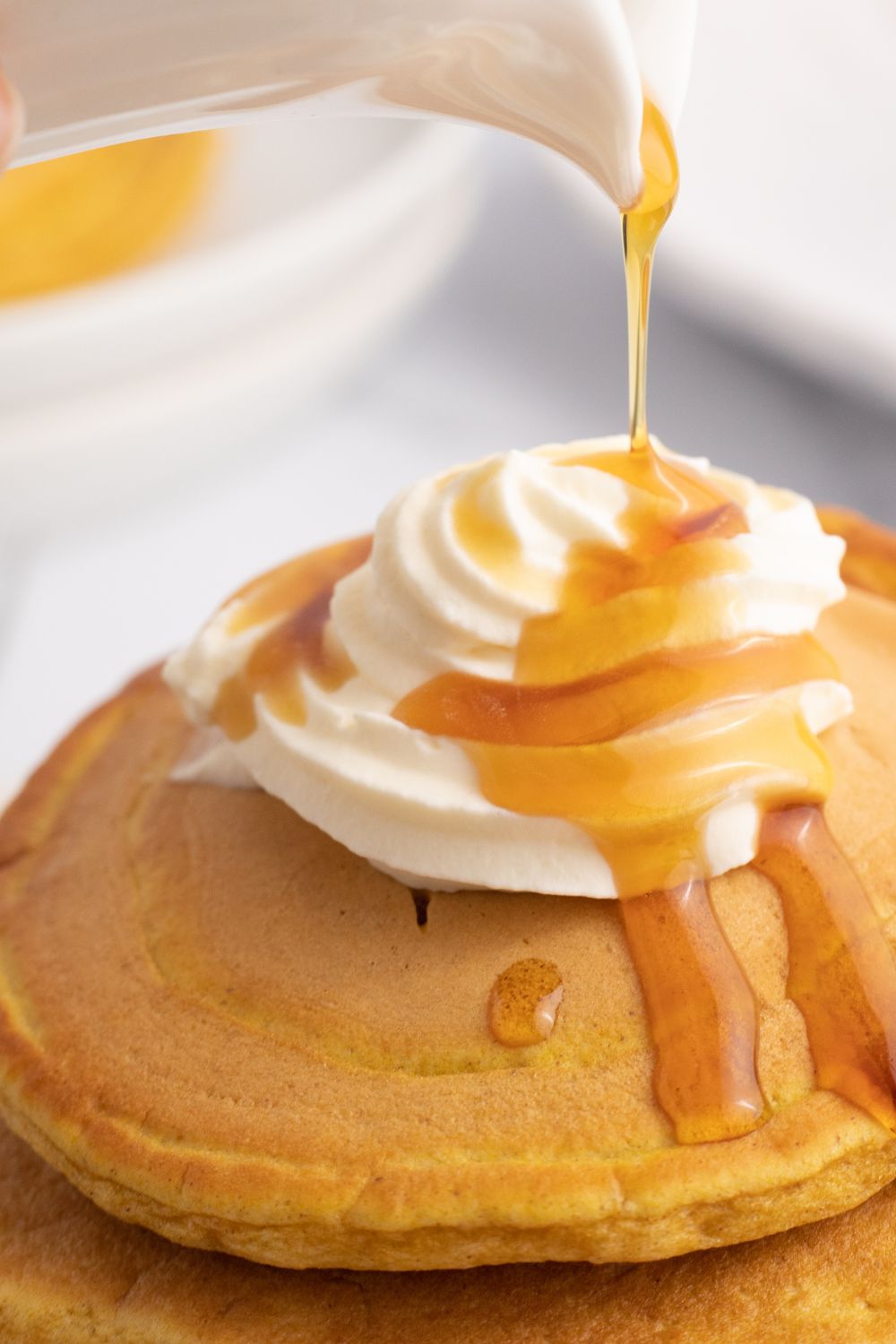 syrup drizzled on pancakes
