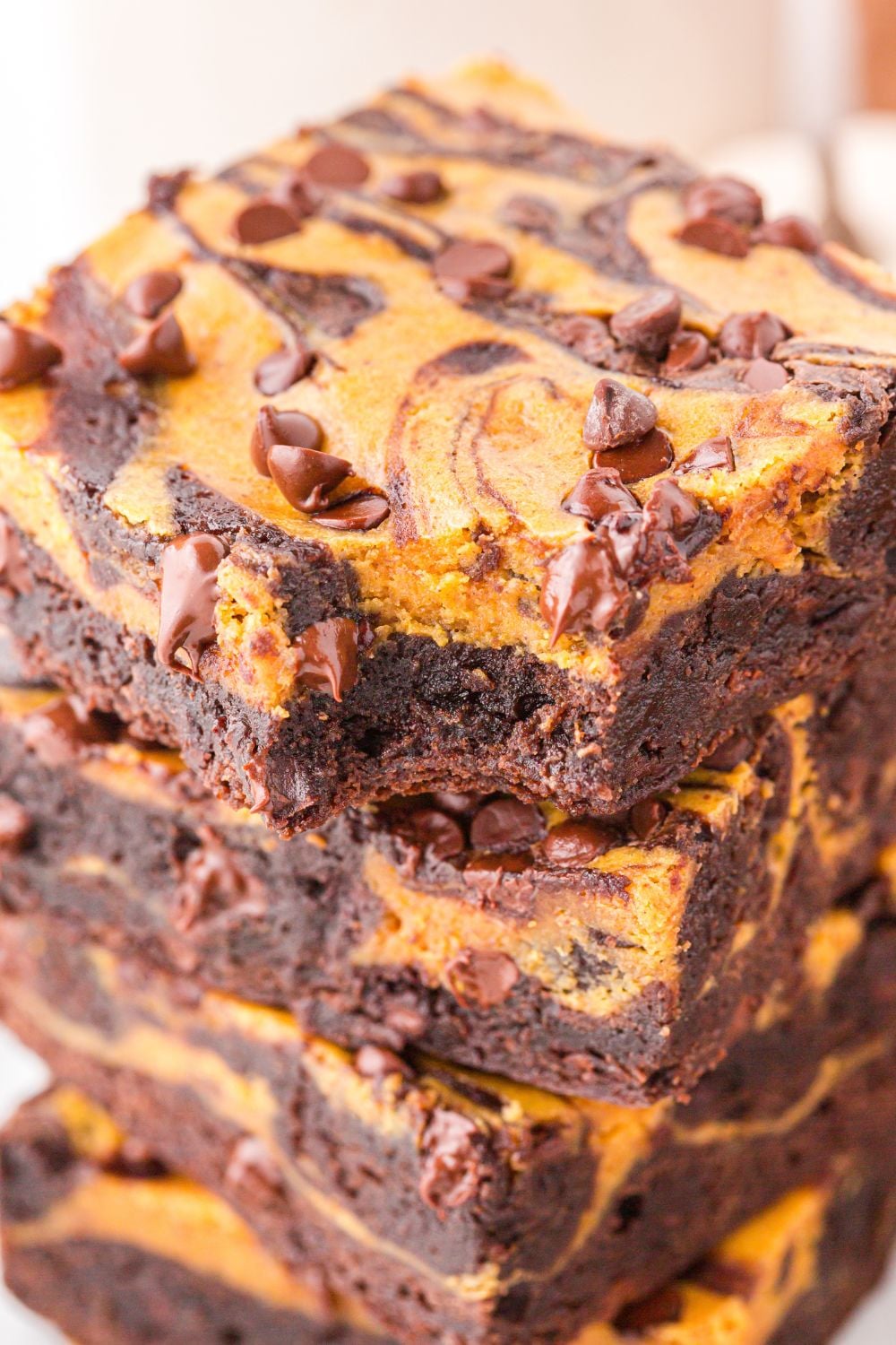pumpkin brownies with one that has a bite taken out