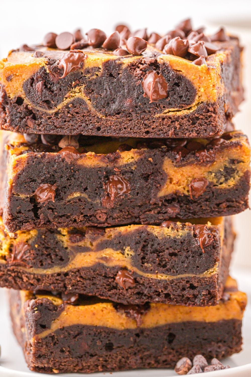 pumpkin brownies with box mix stacked on table