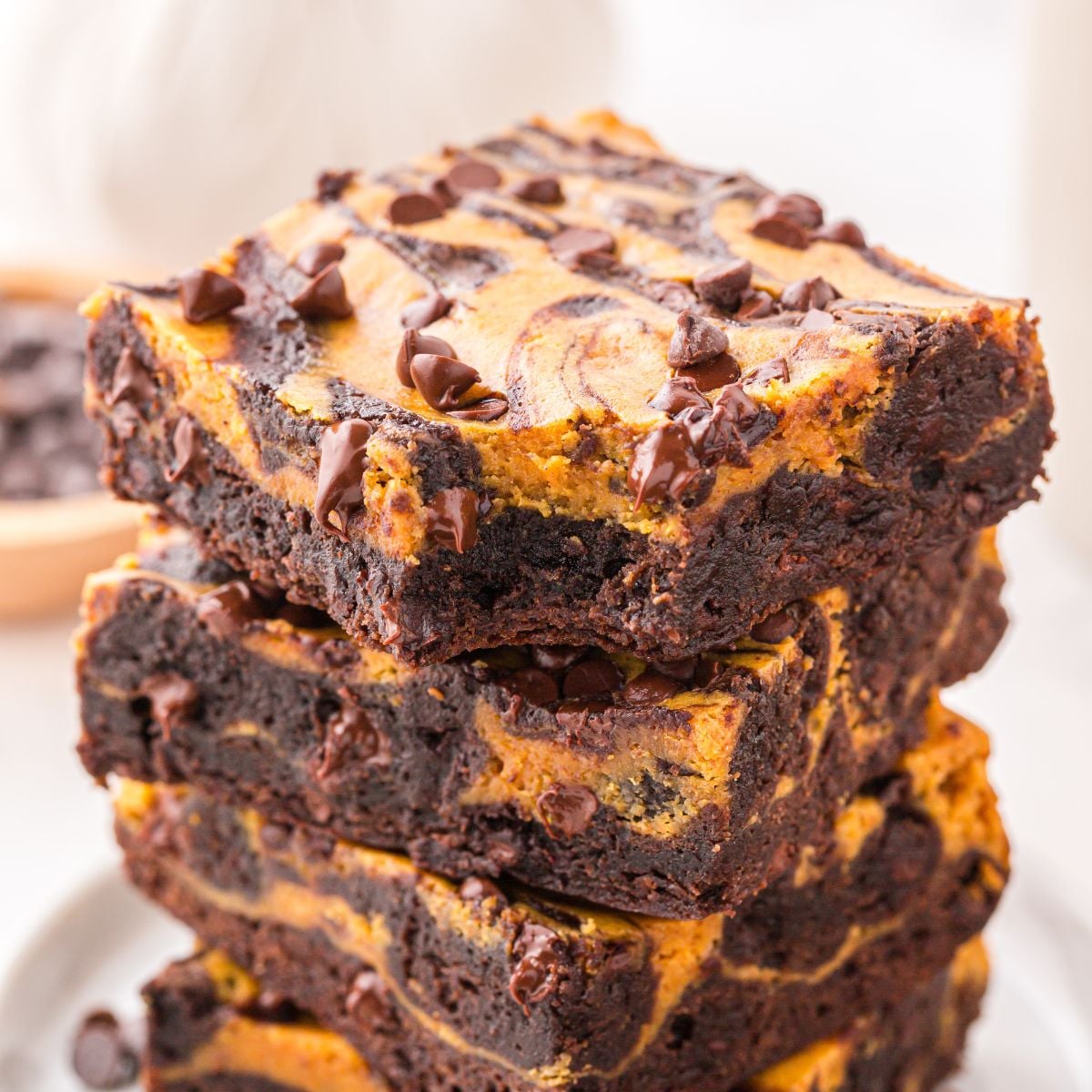 Pumpkin Brownies stacked on a plate