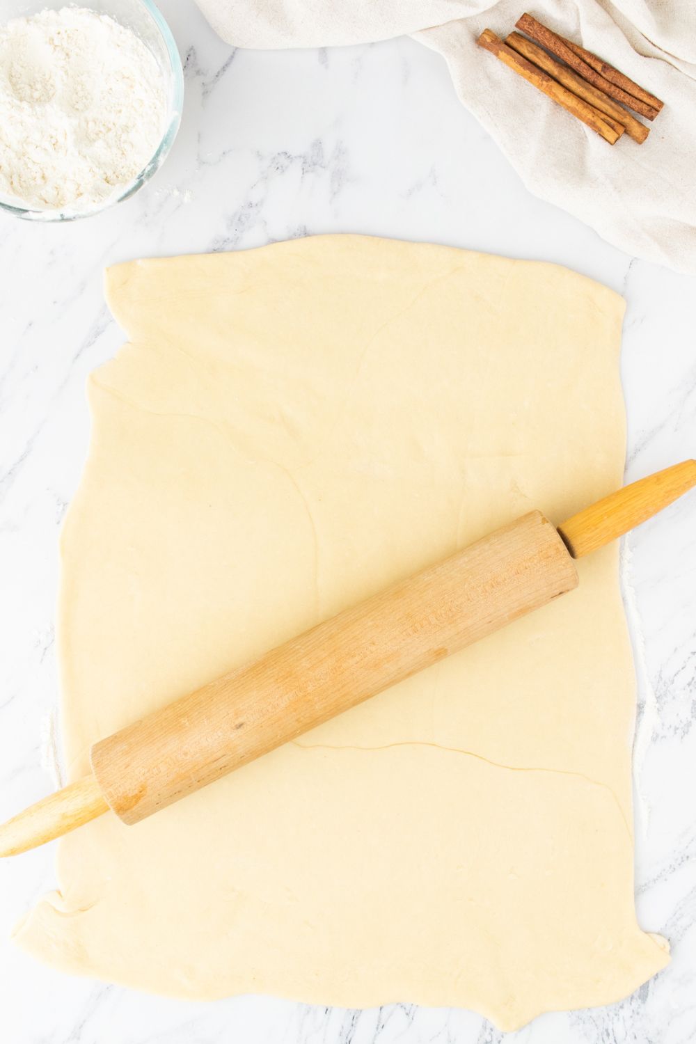 rolling out dough with a rolling pin