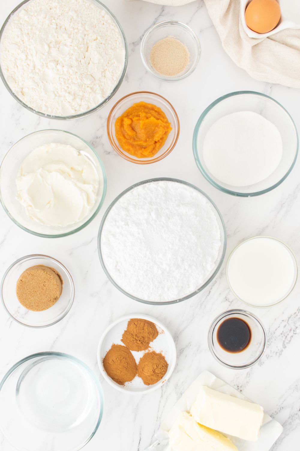 cinnamon roll ingredients in bowls on counter