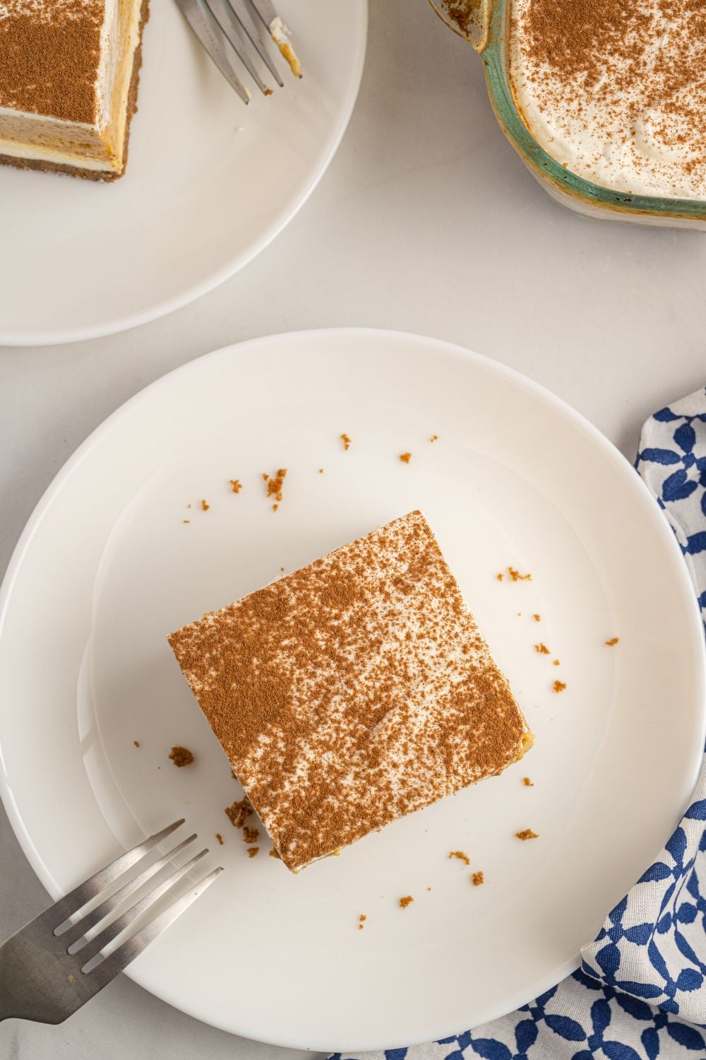 slice of pumpkin dessert on plate with fork on side