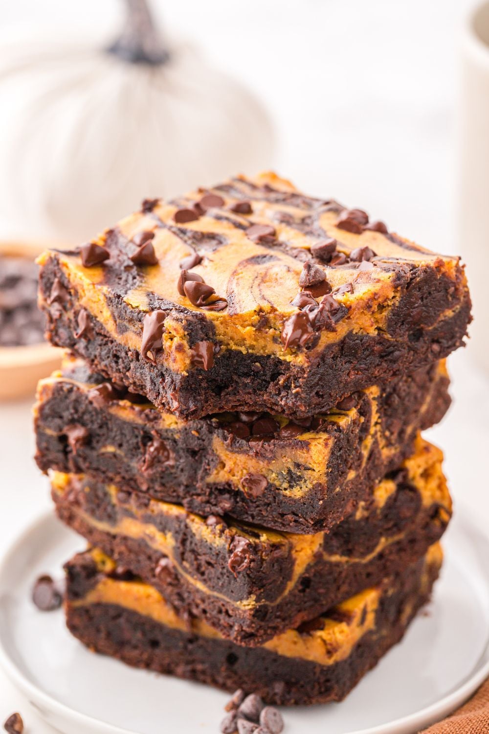 pumpkin pie brownies with bite taken out of it on plate