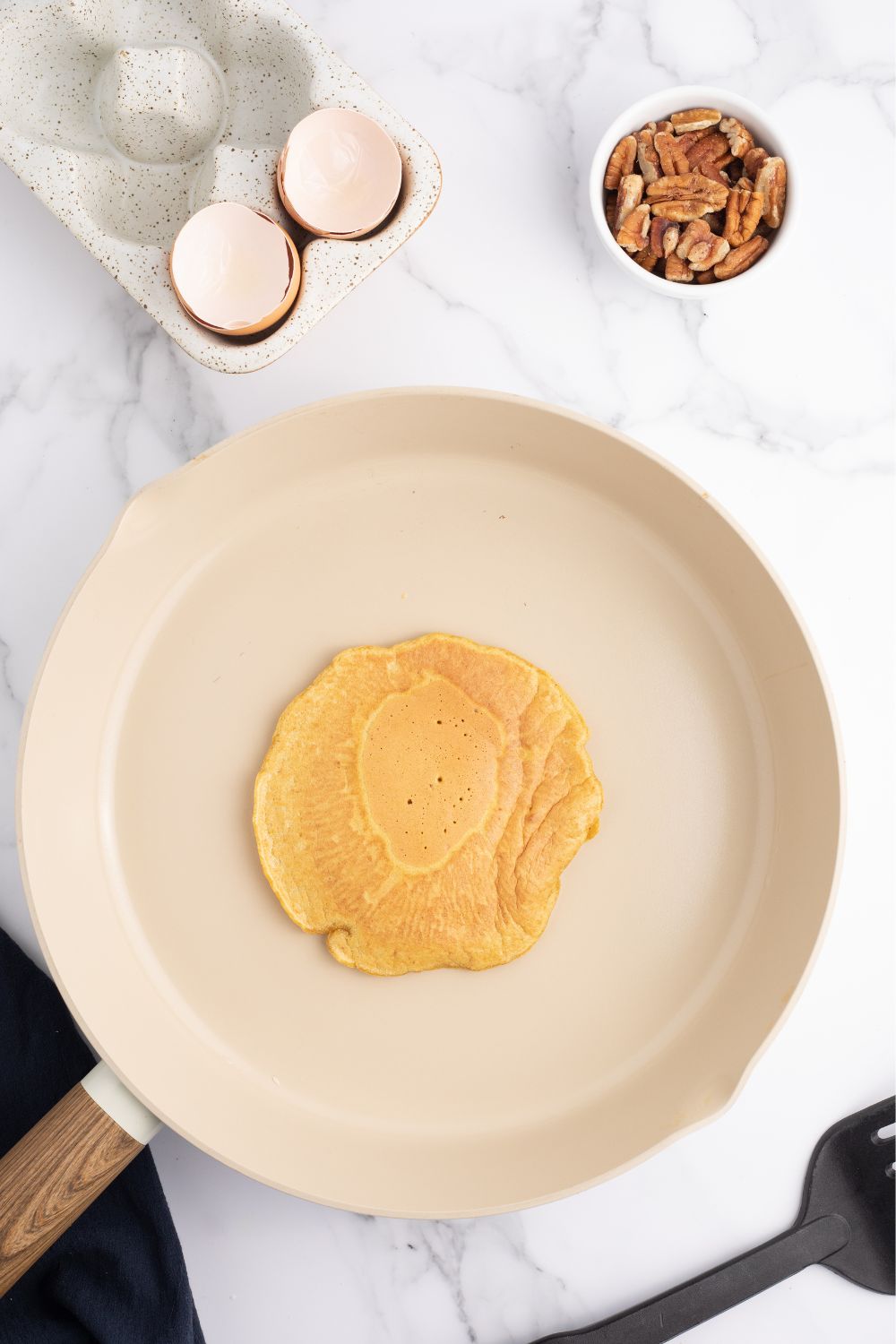 pancake cooking in a skillet 