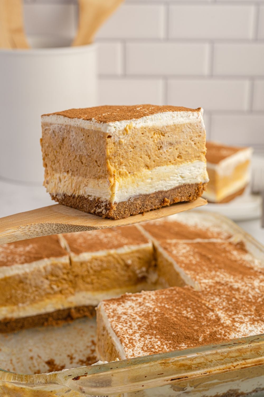 spatula with pumpkin delight and pan below