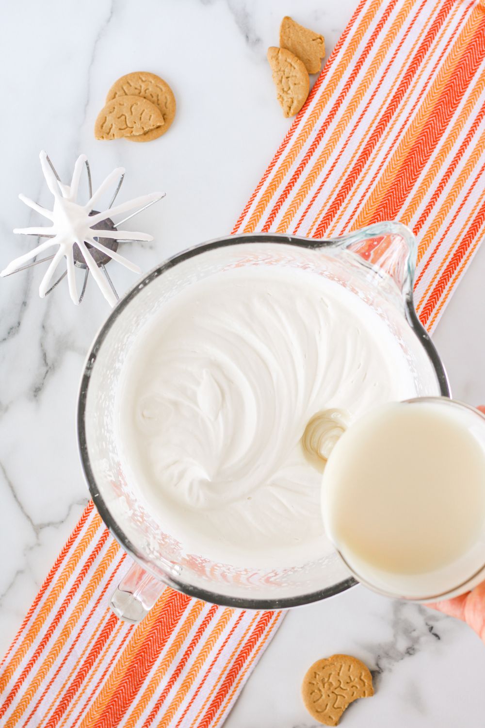 whipped cream with condensed milk in a bowl