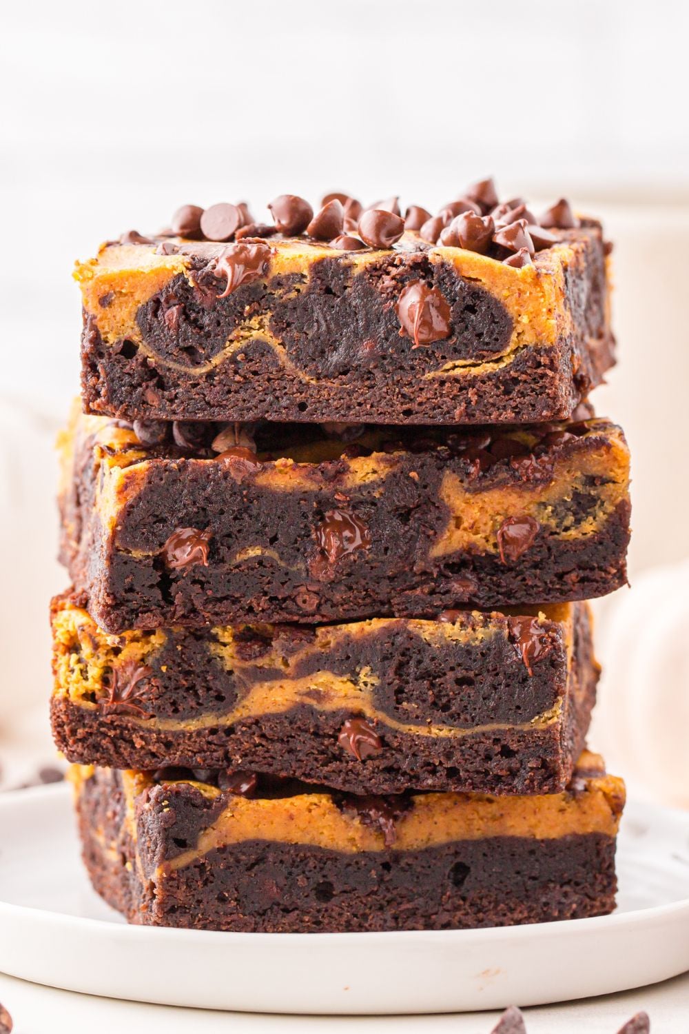 pumpkin swirl brownies stacked on plate