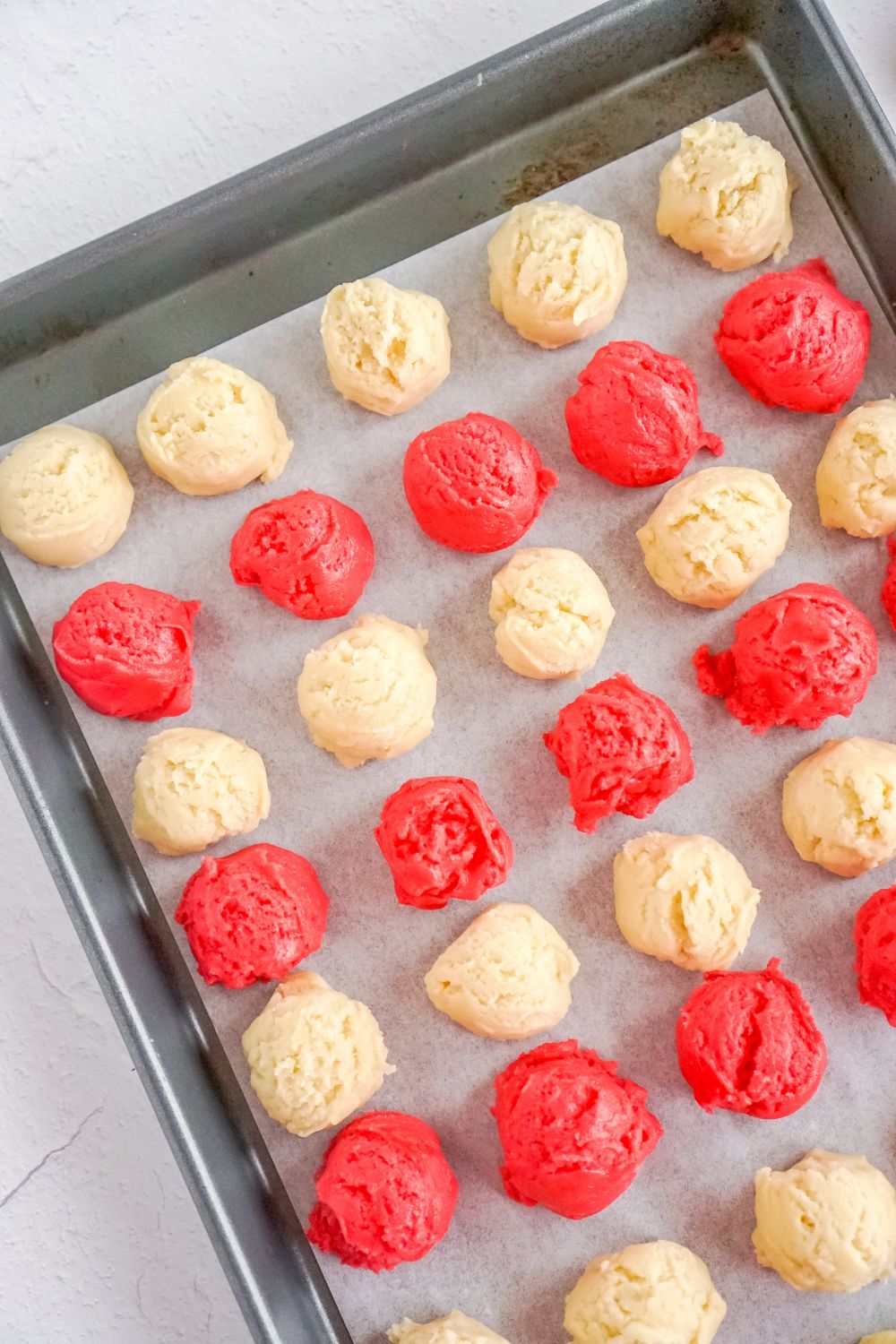 balls of cookie dough on tray