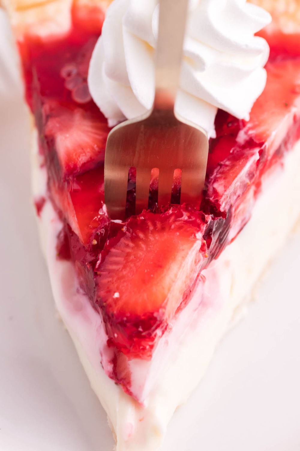 fork going into slice of pie