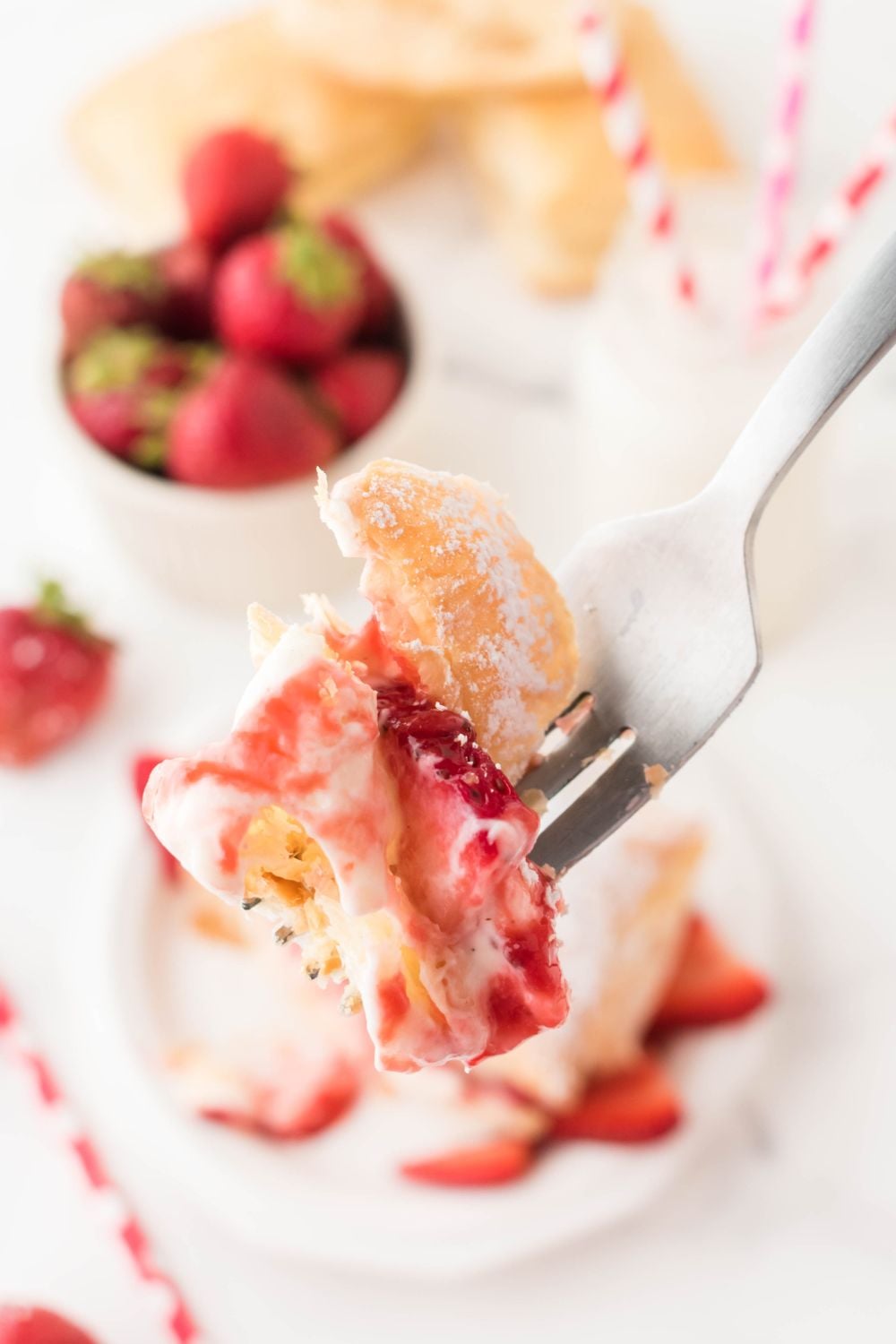 fork with strawberry puff pastry on it