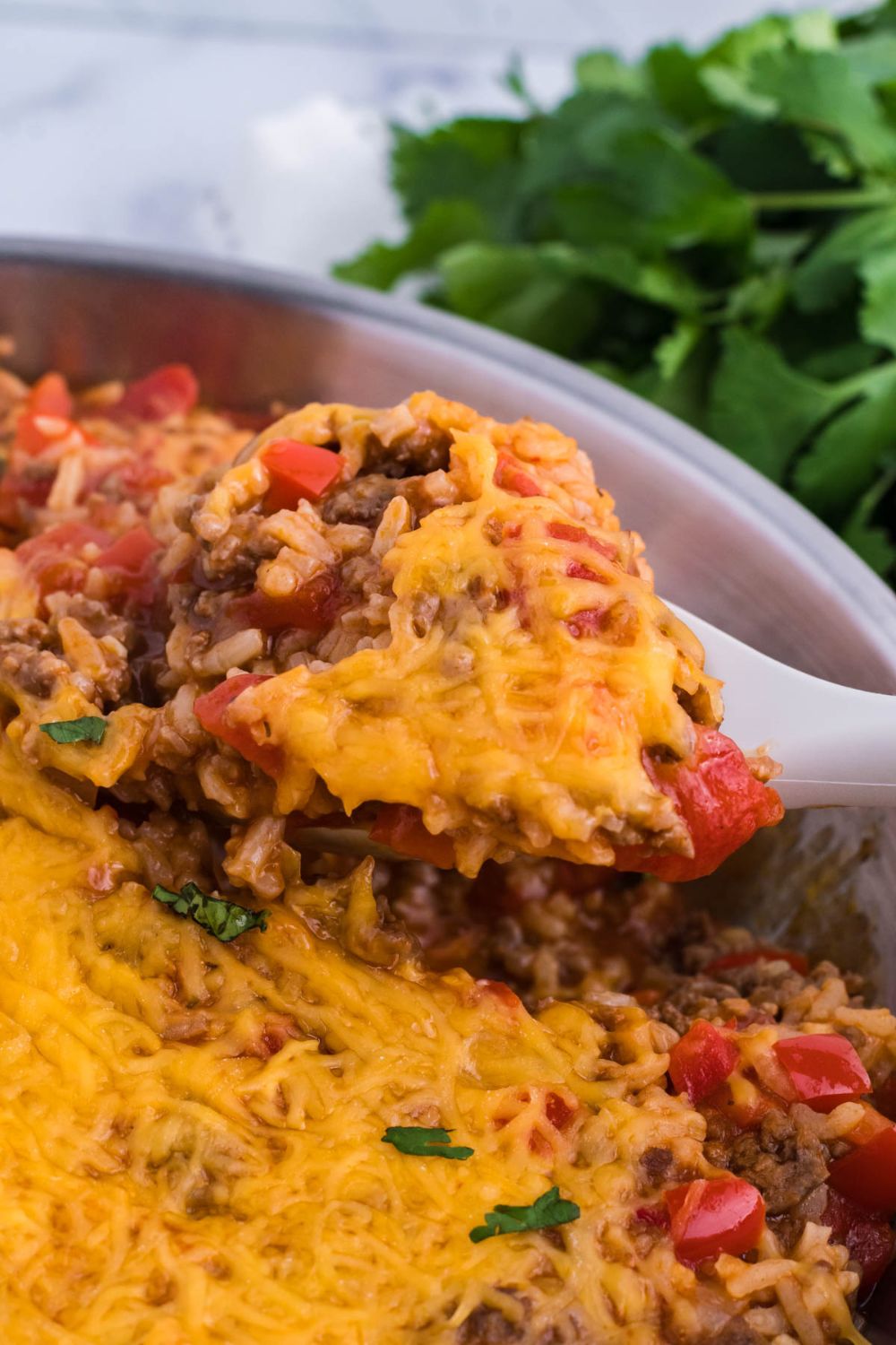 spoon with some stuffed pepper mixture on it
