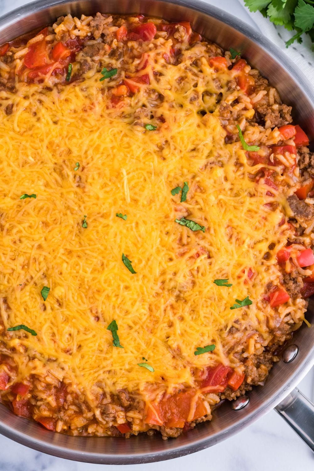 Stuffed Pepper Casserole in pan with cheese on top